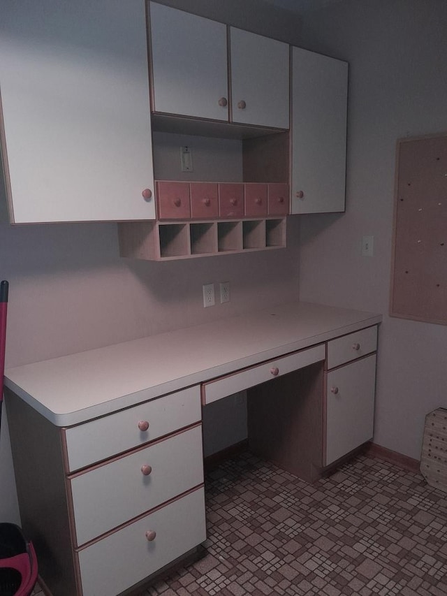 154 E US Highway 34, Mendota, IL 61342 - unfurnished office with built in desk and brick patterned floors