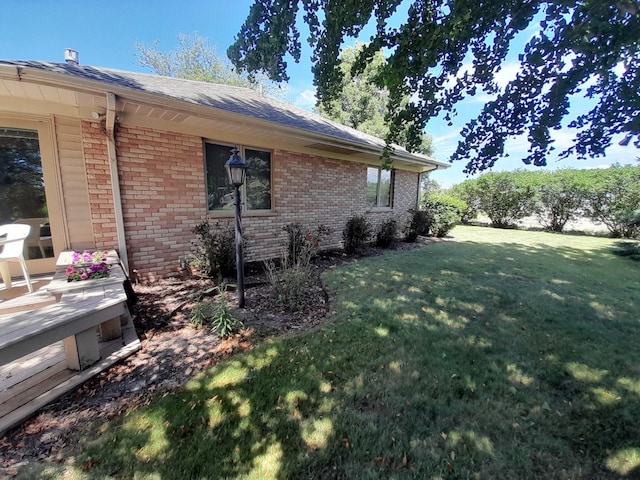 154 E US Highway 34, Mendota, IL 61342 - view of side of property with brick siding, a yard, and a shingled roof