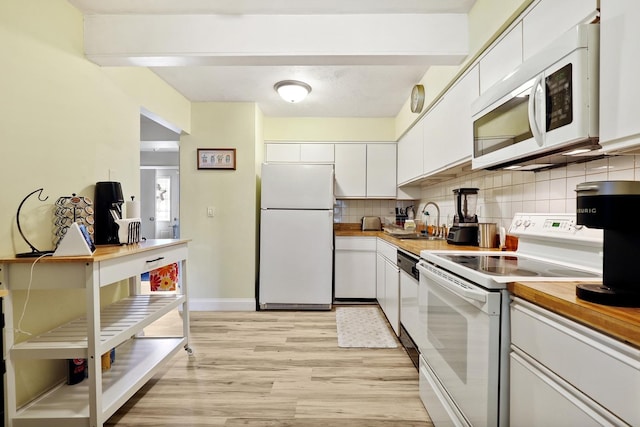 179 Roberts Rd, Bolingbrook, IL 60440 - kitchen with white appliances, light wood finished floors, white cabinets, decorative backsplash, and a desk