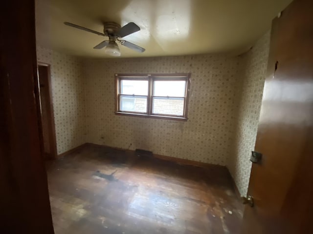 9221 S Normal Ave, Chicago, IL 60620 - unfurnished room with a ceiling fan and wallpapered walls
