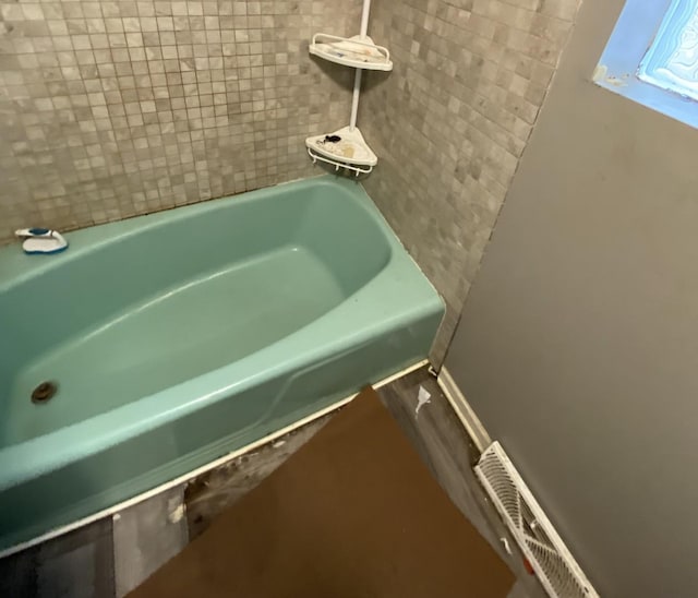 9221 S Normal Ave, Chicago, IL 60620 - bathroom with a bath and baseboards