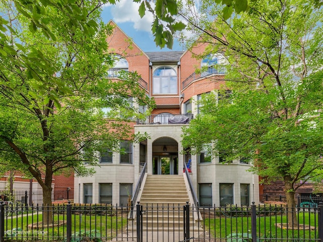 2026 W Pierce Ave Unit 7, Chicago, IL 60622 - townhome / multi-family property featuring stairs, a balcony, and brick siding