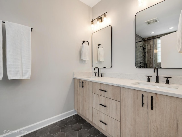 2026 W Pierce Ave Unit 7, Chicago, IL 60622 - bathroom with tile patterned floors, double vanity, and a tile shower