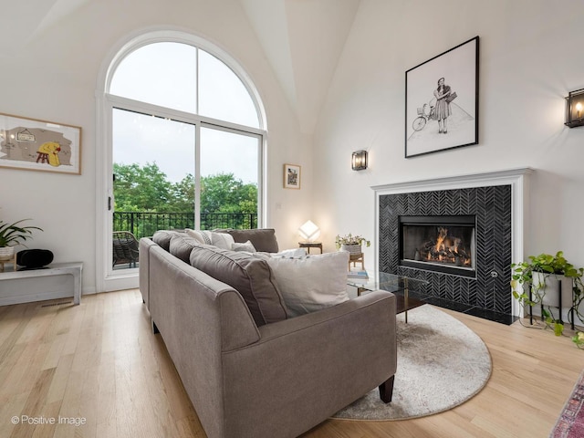 2026 W Pierce Ave Unit 7, Chicago, IL 60622 - living room featuring a fireplace, light wood-type flooring, and high vaulted ceiling