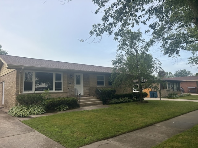 248 W Elmwood Dr, Chicago Heights, IL 60411 - ranch-style home featuring brick siding, a front yard, and roof with shingles