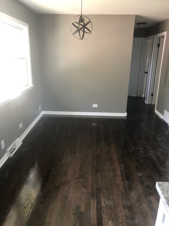 248 W Elmwood Dr, Chicago Heights, IL 60411 - spare room featuring dark wood-style flooring and baseboards
