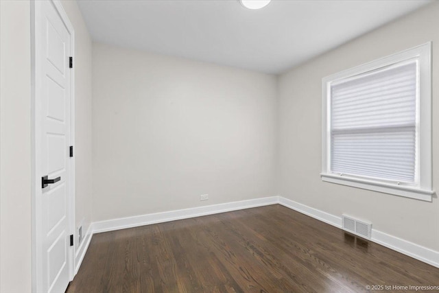 2552 W 117th Pl, Chicago, IL 60655 - unfurnished room with dark wood-type flooring and baseboards