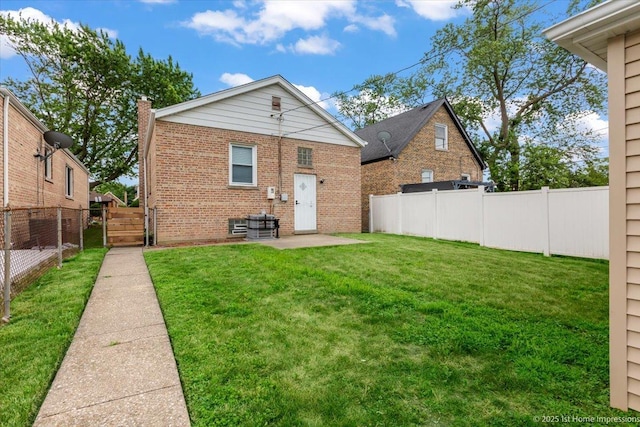 2552 W 117th Pl, Chicago, IL 60655 - rear view of house with brick siding, a patio area, and a chimney