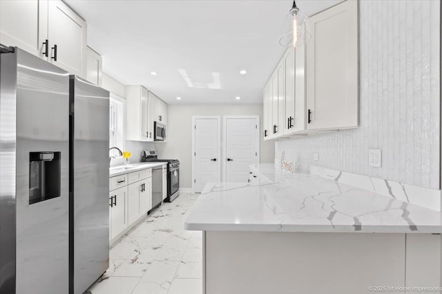 2552 W 117th Pl, Chicago, IL 60655 - kitchen with stainless steel appliances, light marble finish flooring, white cabinets, light stone countertops, and recessed lighting