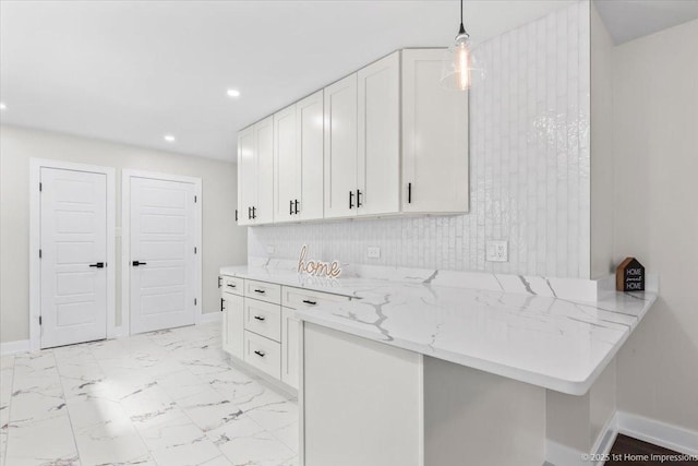 2552 W 117th Pl, Chicago, IL 60655 - kitchen featuring white cabinetry, recessed lighting, light stone counters, pendant lighting, and a peninsula