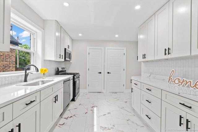 2552 W 117th Pl, Chicago, IL 60655 - kitchen with stainless steel appliances, recessed lighting, white cabinetry, and light marble finish floors