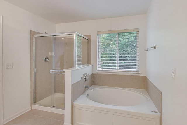31692 N Clearwater Dr, Lakemoor, IL 60051 - bathroom with a bath, a stall shower, and tile patterned flooring