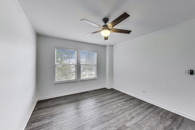 31692 N Clearwater Dr, Lakemoor, IL 60051 - empty room featuring a ceiling fan and dark wood-style flooring