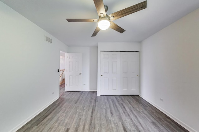31692 N Clearwater Dr, Lakemoor, IL 60051 - unfurnished bedroom with wood finished floors, a closet, and ceiling fan
