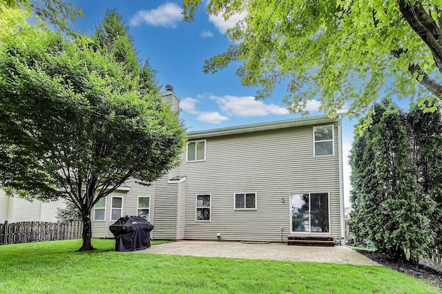 31692 N Clearwater Dr, Lakemoor, IL 60051 - rear view of property with a patio area and a chimney