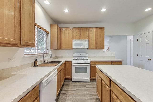 31692 N Clearwater Dr, Lakemoor, IL 60051 - kitchen featuring white appliances, light wood-type flooring, light countertops, and recessed lighting