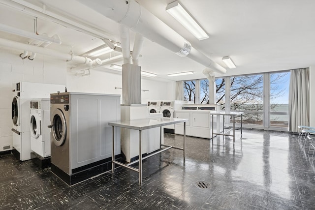 880 N Lake Shore Dr Unit 11D, Chicago, IL 60611 - shared laundry room with washing machine and clothes dryer and dark floors