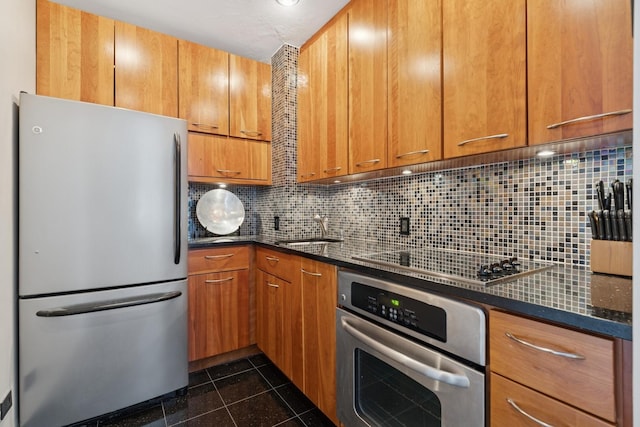 880 N Lake Shore Dr Unit 11D, Chicago, IL 60611 - kitchen featuring appliances with stainless steel finishes, tasteful backsplash, dark stone counters, and brown cabinets