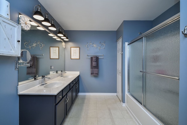 1934 Stoneheather Ave, Aurora, IL 60503 - full bathroom with double vanity, tile patterned floors, and combined bath / shower with glass door
