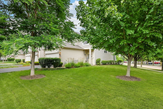 1934 Stoneheather Ave, Aurora, IL 60503 - obstructed view of property with a front lawn and a garage