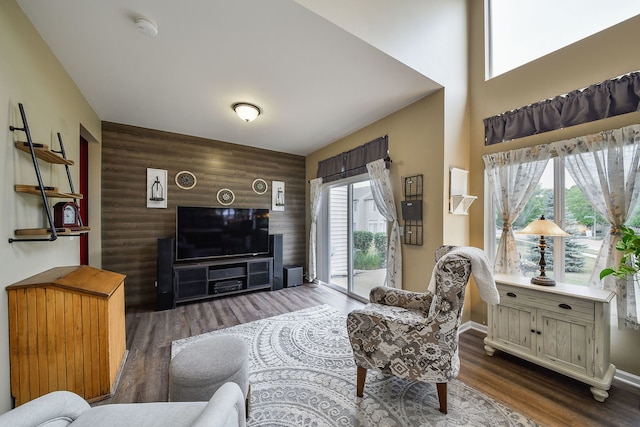 1934 Stoneheather Ave, Aurora, IL 60503 - living area featuring an accent wall, healthy amount of natural light, wood finished floors, and wooden walls