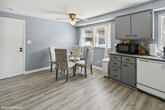 323 Marshall Rd, Bensenville, IL 60106 - kitchen with black microwave, dishwasher, gray cabinets, and a ceiling fan