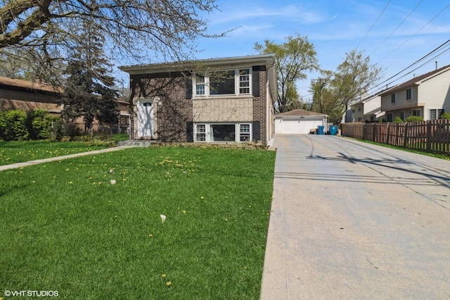 323 Marshall Rd, Bensenville, IL 60106 - view of front facade with brick siding, a detached garage, and an outbuilding