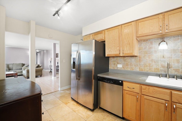 6325 N Sheridan Rd Unit 802, Chicago, IL 60660 - kitchen with appliances with stainless steel finishes, backsplash, light tile patterned flooring, and light brown cabinets