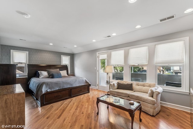 1820 N 75th Ct, Elmwood Park, IL 60707 - bedroom featuring wallpapered walls, light wood-style flooring, and recessed lighting