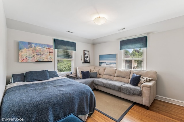 1820 N 75th Ct, Elmwood Park, IL 60707 - bedroom featuring light wood-type flooring and multiple windows
