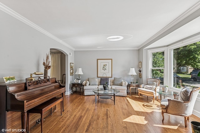 1820 N 75th Ct, Elmwood Park, IL 60707 - living room featuring arched walkways, wood finished floors, and ornamental molding