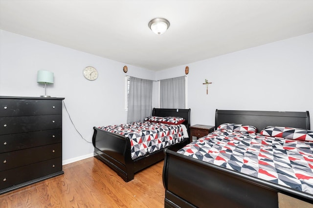 5642 W Dakin St, Chicago, IL 60634 - bedroom featuring light wood-style flooring and baseboards