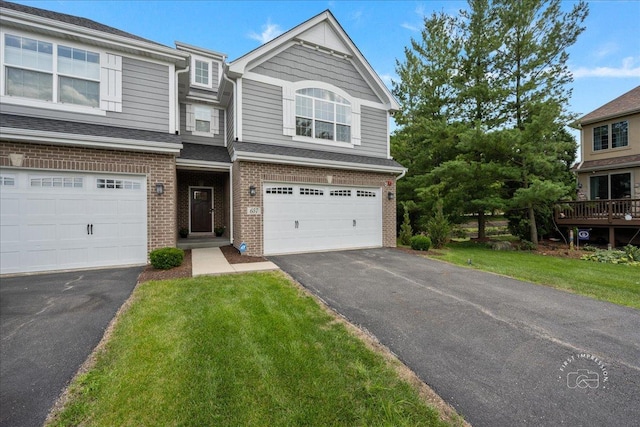 657 Bourbon Ct, Naperville, IL 60565 - view of front facade with brick siding, asphalt driveway, an attached garage, and a front lawn