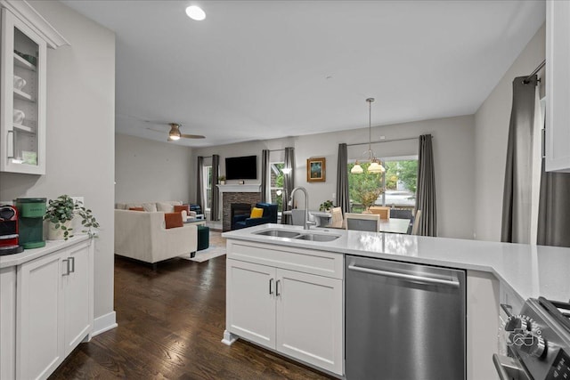 657 Bourbon Ct, Naperville, IL 60565 - kitchen featuring dishwasher, stove, a stone fireplace, light countertops, and recessed lighting