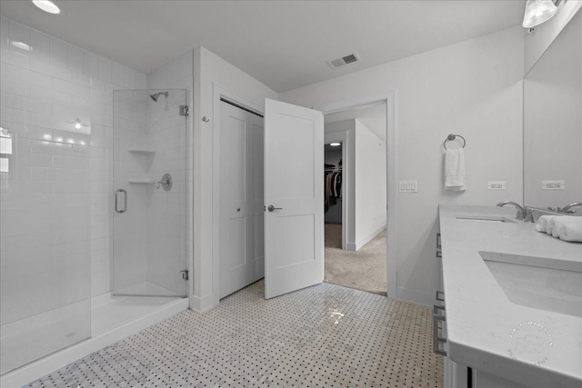 657 Bourbon Ct, Naperville, IL 60565 - bathroom with a stall shower, double vanity, tile patterned floors, and a spacious closet