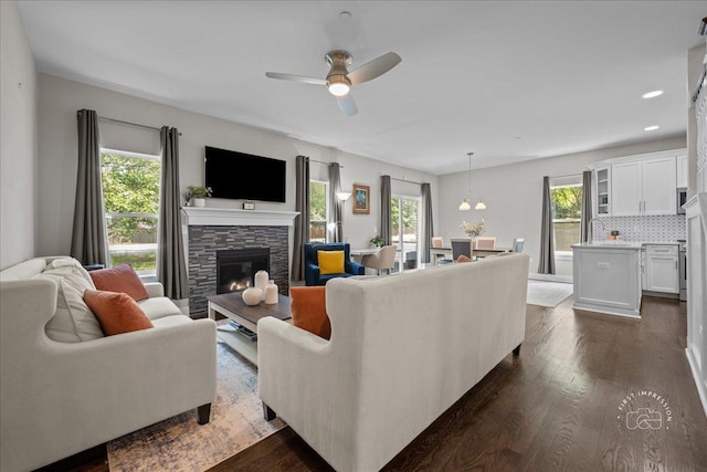 657 Bourbon Ct, Naperville, IL 60565 - living room featuring a fireplace, ceiling fan, dark wood-style floors, and recessed lighting