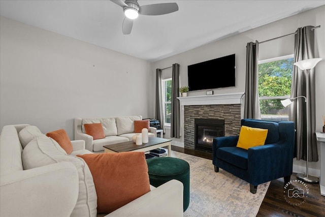657 Bourbon Ct, Naperville, IL 60565 - living room featuring healthy amount of natural light, a ceiling fan, wood finished floors, and a fireplace