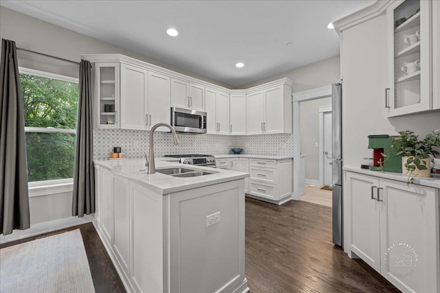 657 Bourbon Ct, Naperville, IL 60565 - kitchen with stainless steel microwave, white cabinetry, light countertops, and recessed lighting