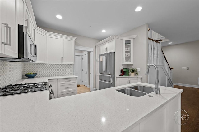 657 Bourbon Ct, Naperville, IL 60565 - kitchen featuring stainless steel appliances, wood finished floors, light stone counters, decorative backsplash, and recessed lighting