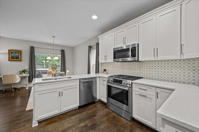 657 Bourbon Ct, Naperville, IL 60565 - kitchen featuring appliances with stainless steel finishes, a peninsula, dark wood-style flooring, white cabinets, and recessed lighting