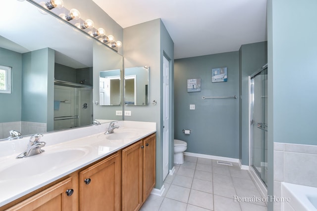 239 Morgan Valley Dr, Oswego, IL 60543 - bathroom featuring tile patterned flooring, double vanity, a bath, and a shower with door