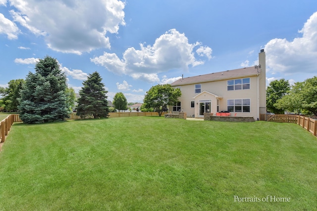239 Morgan Valley Dr, Oswego, IL 60543 - rear view of property with a chimney, a fenced backyard, and a patio area
