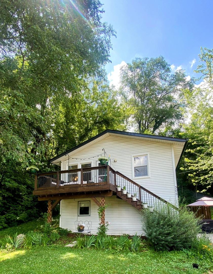 305 N Blackhawk Dr, Byron, IL 61010 - back of house featuring stairway and a wooden deck