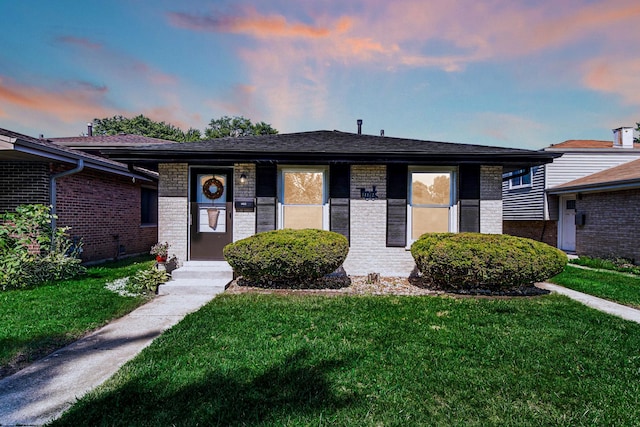 14112 S Hoxie Ave, Burnham, IL 60633 - view of front of property with a lawn and brick siding