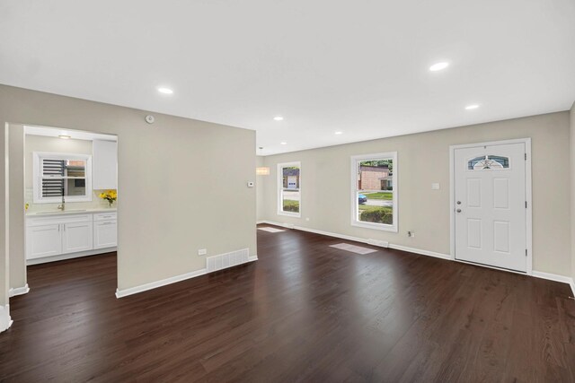 14112 S Hoxie Ave, Burnham, IL 60633 - empty room featuring stairway, dark wood-style floors, and recessed lighting