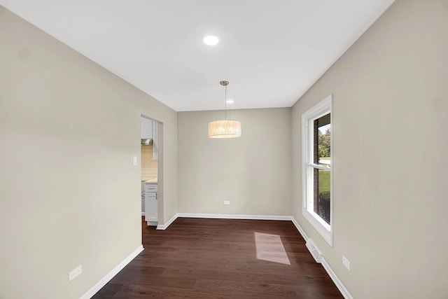14112 S Hoxie Ave, Burnham, IL 60633 - empty room with dark wood-style floors, recessed lighting, and a chandelier