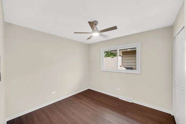 14112 S Hoxie Ave, Burnham, IL 60633 - spare room featuring dark wood-style floors and ceiling fan