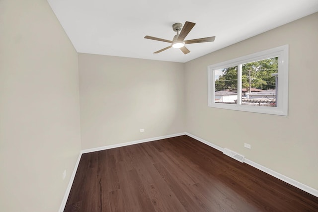 14112 S Hoxie Ave, Burnham, IL 60633 - spare room with dark wood finished floors and ceiling fan