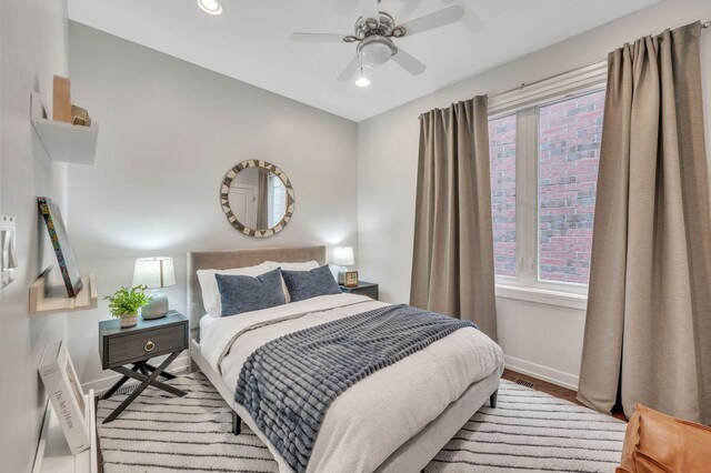 2423 W Erie St, Chicago, IL 60612 - bedroom with multiple windows, wood finished floors, recessed lighting, and a ceiling fan