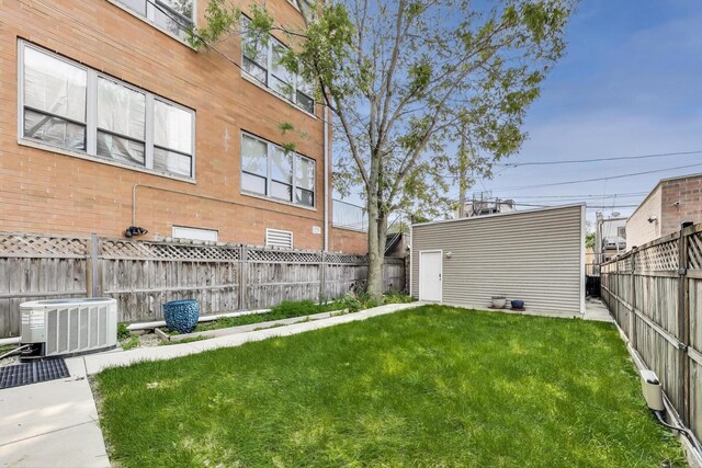 2423 W Erie St, Chicago, IL 60612 - fenced backyard featuring an outdoor structure